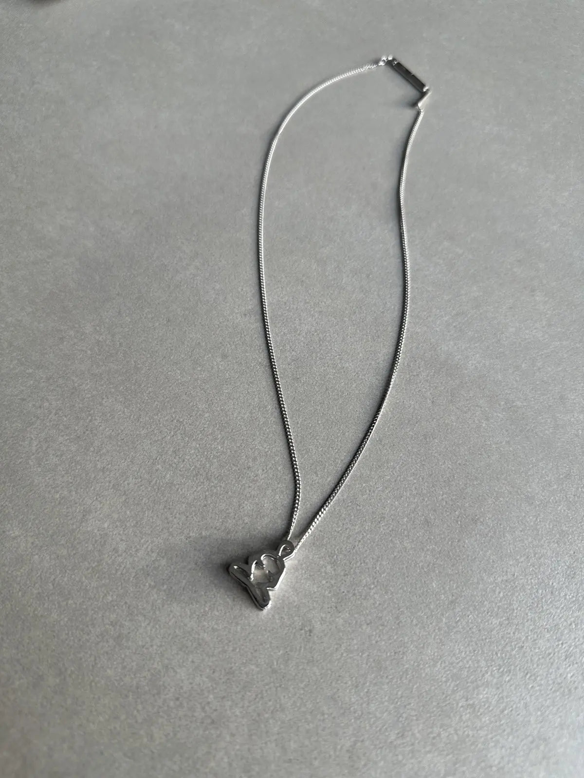 Dior homme SS03 “Follow me” Meditating figure necklace