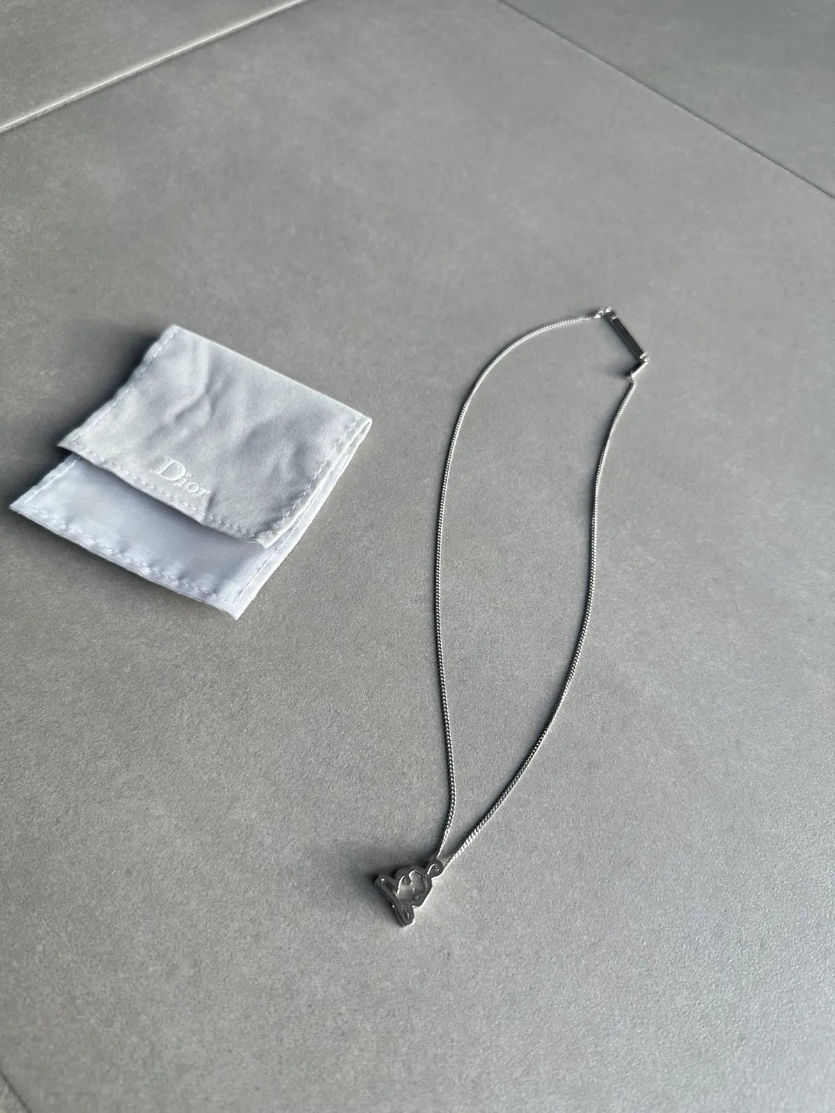 Dior homme SS03 “Follow me” Meditating figure necklace