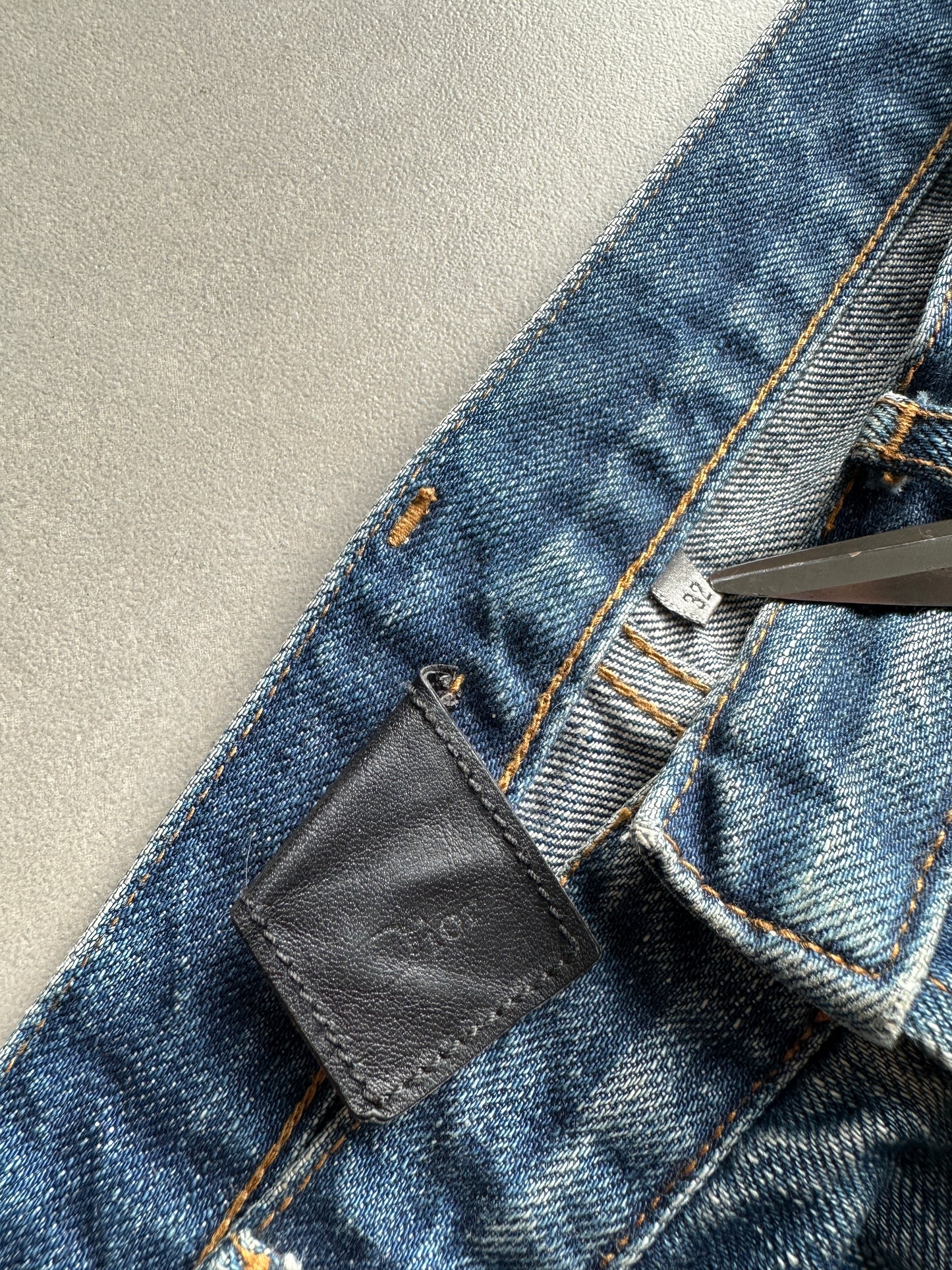 Dior Homme AW06 washed blue clawmark jeans